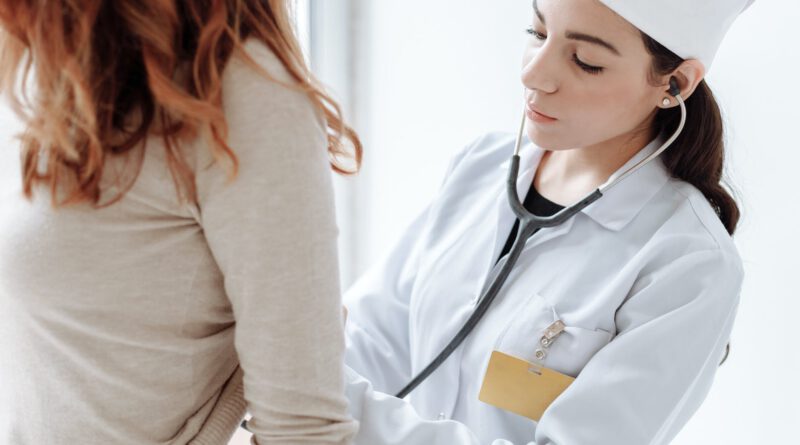 photo of doctor checking on her patient