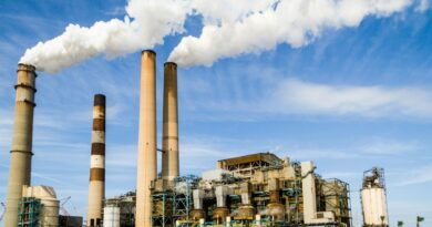 photo of an industrial factory emitting smoke